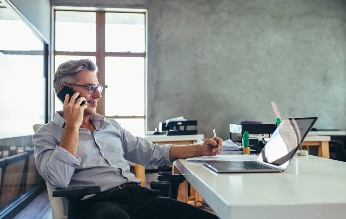 business owner using greylock online banking on laptop